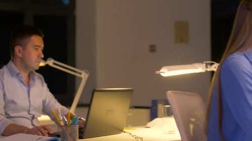 Business People Working Late at Night Office