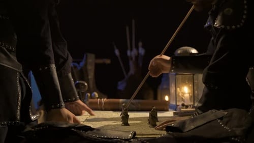 Men Planning Strategy on Map With Figurines