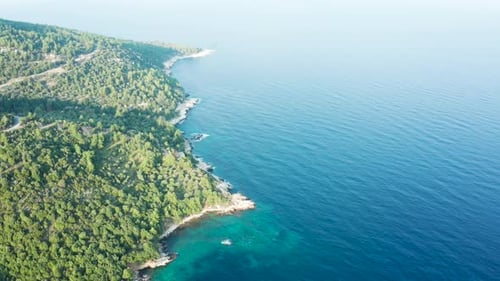 Aerial Footage of Beautiful Steep Rocky Coast Line with Turquoise Sea Water