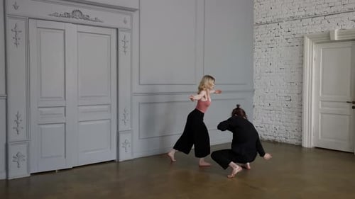 Pair of Ballet Dancers are Dancing Contemporary Dance Young Woman and Man are Rehearsing in Hall