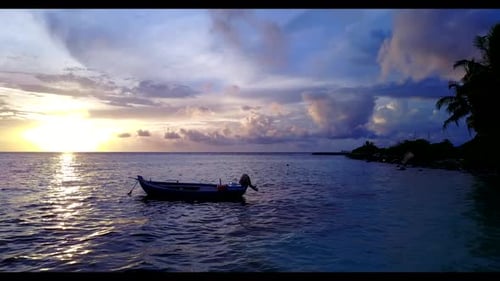 Aerial top down panorama of exotic resort beach vacation by blue water and white sand background of