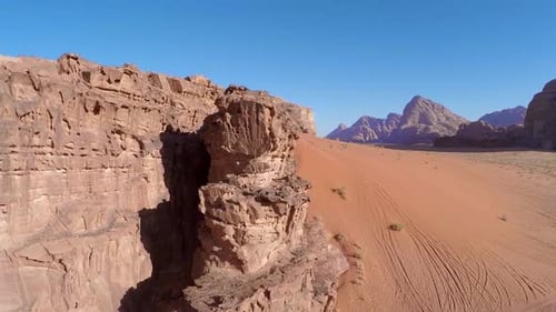 Desert Landscape with Red Sand and Mountains