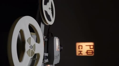 Watching Films On Retro Cinema Projector.