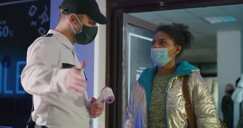 Asian Woman in Spacesuit Entering Mall During Pandemic