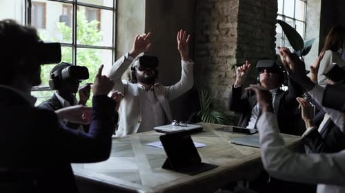 Diverse business people working with virtual reality headsets inside office