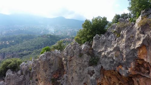 Close Up of Rocky Mountain Cliff Over the Beautiful Green Valley