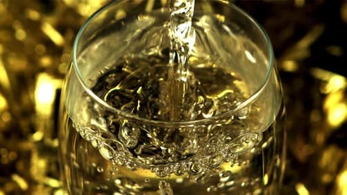 Wine Glass Being Filled with Bubbly Beverage