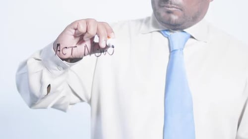 Person Writes Act Now on Clear Background