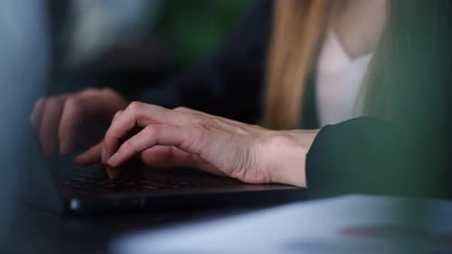 Businesswoman Hands Typing on Laptop Keyboard in Office. Woman Arms Using Laptop