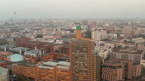 AERIAL: View of Berlin Germany Atrium Tower Potsdamer Platz Skyscraper Cityscape in Beautiful Orange