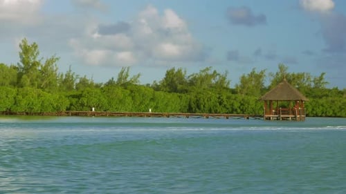 Sailing By Wooden Pier in the Sea