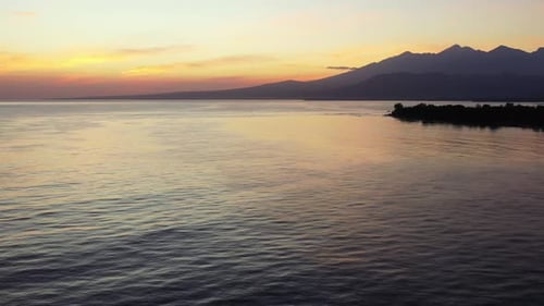 Golden Sunset At The Beach. Aerial Magic Hour Shot Above The Calm Sea