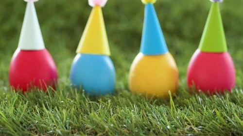 Colorful Birthday Eggs with Hats on Grass