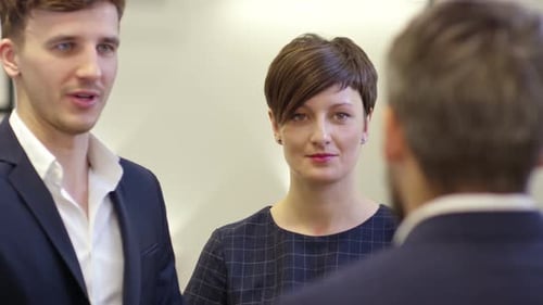 Joyous Colleagues Discussing Business Details