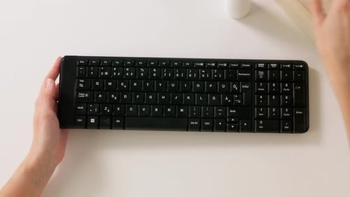 Close Up of Woman Cleaning Keyboard with Sanitizer