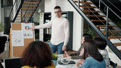 Joyful Employee Sharing Success with Colleagues Speaking Dancing Doing Highfive in Office