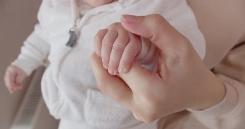 Sweet Close Up of Baby Holding Hand