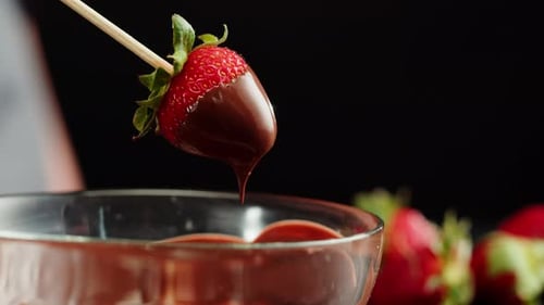 Strawberry in Melted Chocolate Closeup Melting Chocolate Bar for Fondue
