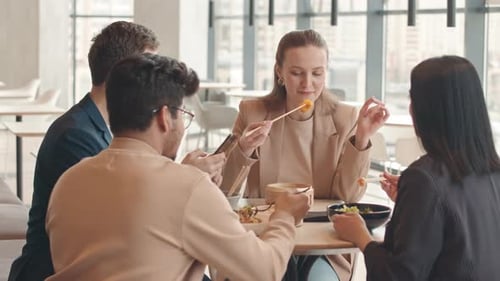 Group of Colleagues Having Lunch Together at Food Court