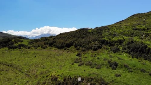 Green Hills and Distant Mountains Aerial View