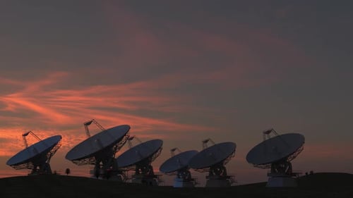 Satellite Dishes Rotating at Sunset