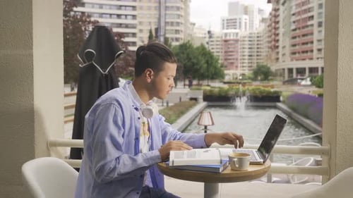 Freelance young man in cafe.