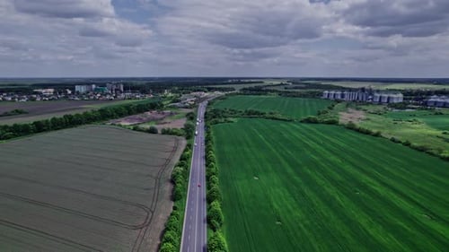 Aerial View of Road Passing Through a Rural Landscape