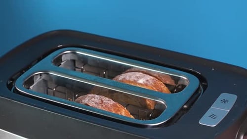 Toast Popping Up Out Of Toaster