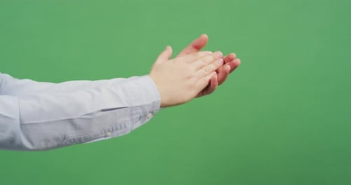 Close up of a man's hands applauding
