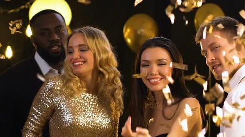 Friends Celebrating With Confetti and Golden Balloons