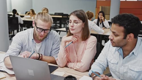 Three Colleagues Working Together on a Project