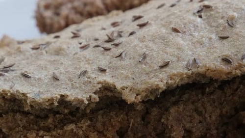 Brown Seeded Bread Close-Up on White Plate