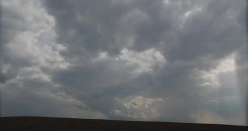 Rain Clouds Through Which The Sun's Rays Pass Timelapse