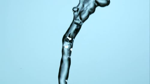 Water Pouring in Abstract Shapes on Blue Background