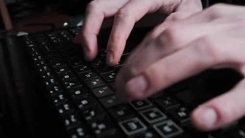 Typing Text on Laptop Keyboard Men Hands Press the Black Keys of Laptop