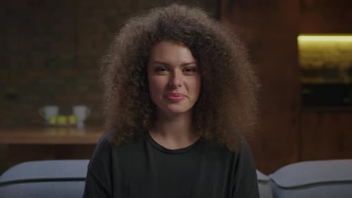 Smiling Woman with Curly Hair Portrait Indoors