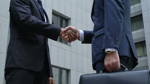 Businessmen Shaking Hands in the City