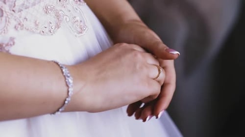 Bride Adjusts Ring on Wedding Day Close Up