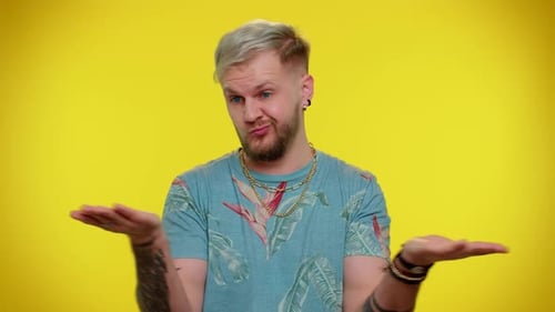 Confused Man Gesturing with Hands in Studio