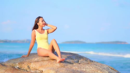 Asian woman enjoy around beautiful beach sea ocean