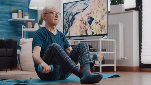 Senior Man Doing Dumbbell Workout at Home