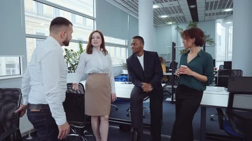 Office Colleagues in Discussion in Modern Workplace