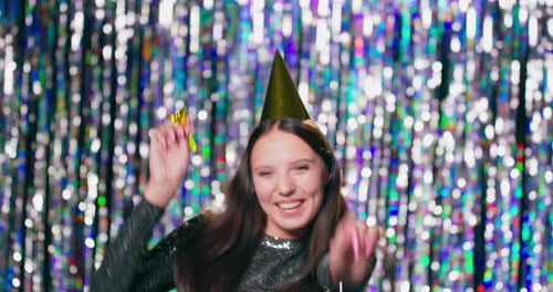 Young Woman Dances at Birthday Party Celebration