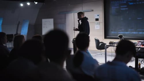 Presenter Speaking to Audience at Corporate Tech Conference