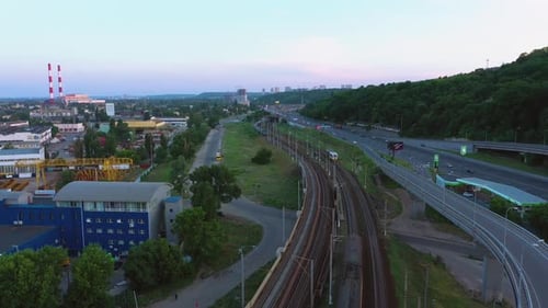 Aerial Cityscape with Highway Road and Railway with Train