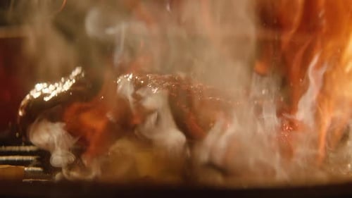 Delicious Meat Sizzling on a Grill with Butter