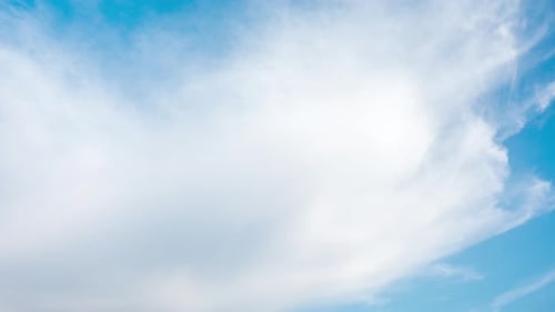 Blue Sky with Fluffy White Clouds