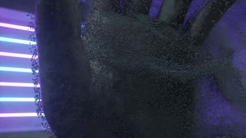 Futuristic Hand Dissolving into Particles with Neon Lights