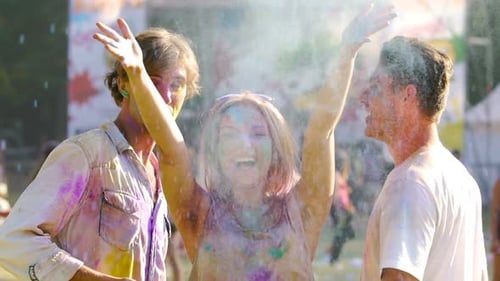 Beautiful Blonde Female Throwing Handful of Color Powder in Air, Enjoying Life