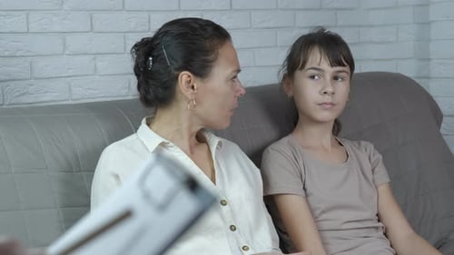 Mother and Daughter Disagreeing Over Phone Use